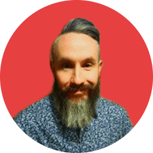 Tom Red Background Headshot-modified