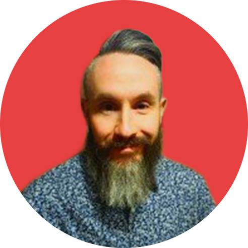 Tom Red Background Headshot-modified